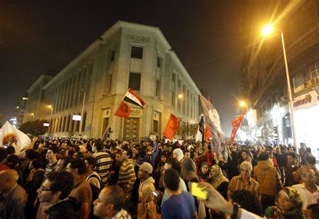 People gather for a protest against a new law restricting demonstrations, in downtown Cairo November 27, 2013. REUTERS/Mohamed Abd El Ghany