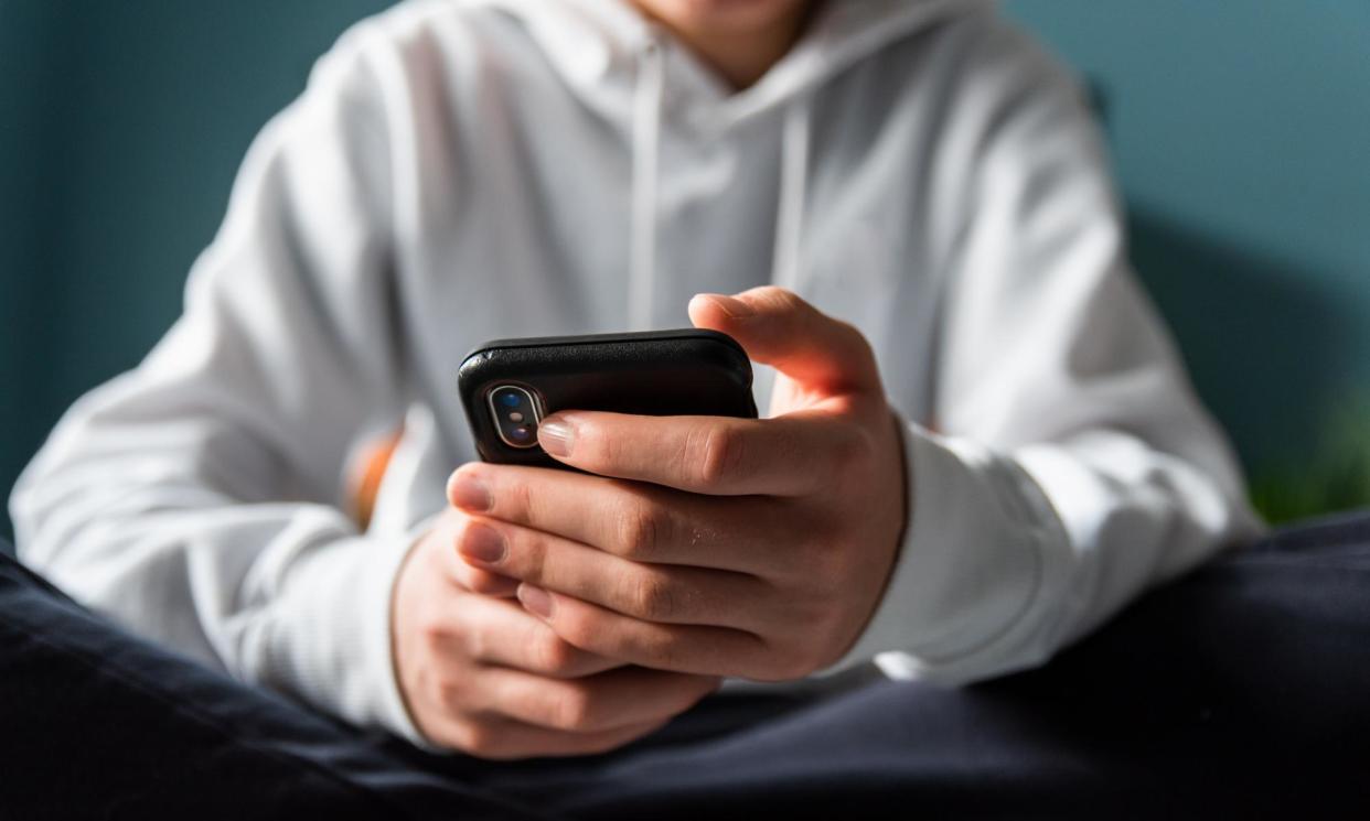 <span>The government is looking for ways to improve online safety laws amid concerns about websites and algorithms serving harmful or violent content to users.</span><span>Photograph: Cavan Images/Getty Images/Cavan Images RF</span>