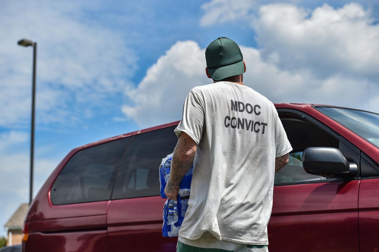 Incarcerated persons help distribute water amidst Jackson's water crisis at the Salvation Army facility in Jackson, as seen here in a file photo from Friday, Sept. 2, 2022. Now inmates will be used to help clean up state highways in Jackson and Hinds County