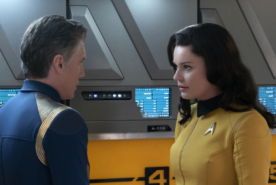 Capt. Pike (Anson Mount) consults with Number One (Rebecca Romijn), reporting from the starship Enterprise. <cite>Michael Gibson/CBS</cite>