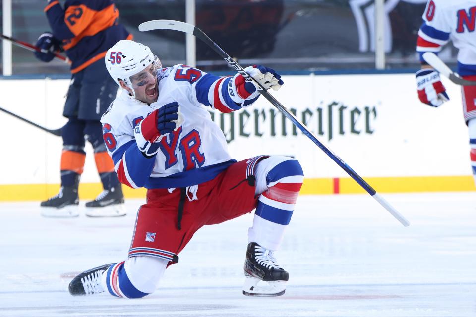 EAST RUTHERFORD, NEW JERSEY - FEBRUARY 18: Erik Gustafsson #56 of the New York Rangers celebrates after scoring a goal against the New York Islanders during the first period during the 2024 Navy Federal Credit Union Stadium Series at MetLife Stadium on February 18, 2024 in East Rutherford, New Jersey.