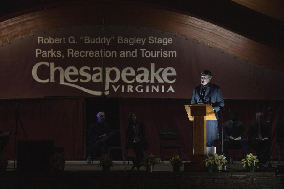 Virginia Gov. Glenn Youngkin speaks during a candlelight vigil at Chesapeake City Park in Chesapeake, Va., Monday, Nov. 28, 2022, for the six people killed at a Walmart in Chesapeake, Va., when a manager opened fire with a handgun before an employee meeting last week. (AP Photo/Carolyn Kaster)