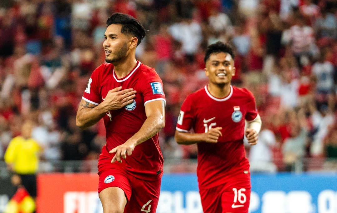 Singapore wing-back Christopher van Huizen (left) celebrates scoring the Lions' opening goal against Guam in their 2026 Fifa World Cup qualifier at National Stadium. (PHOTO: Football Association of Singapore/Facebook)