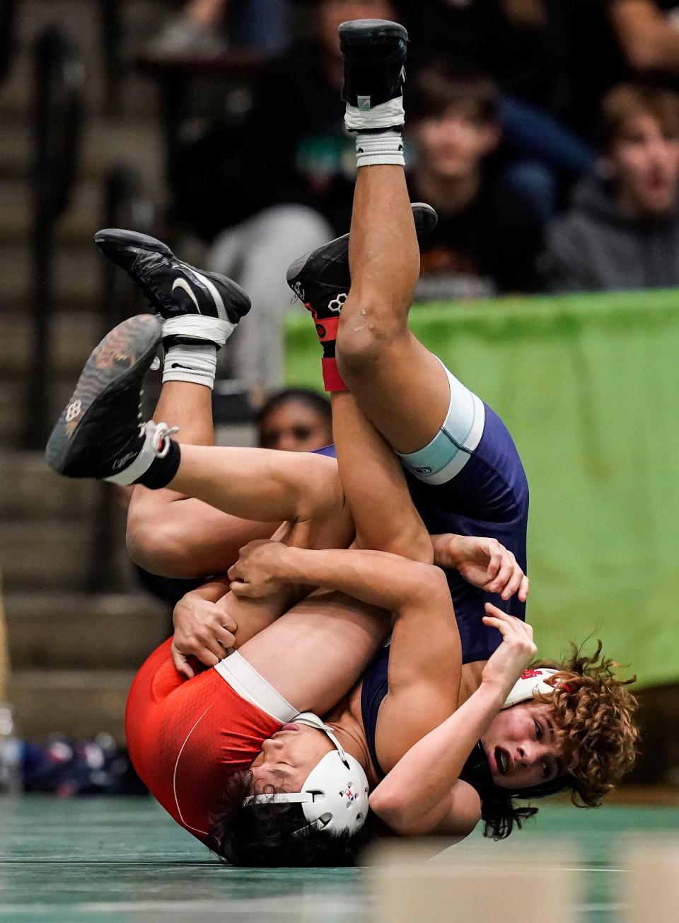 Perry Meridian Hurai Lian wrestles New Palestine Gunner Butt during the IHSAA wrestling semi-state on Saturday, Feb. 11, 2023 at New Castle Fieldhouse in New Castle.