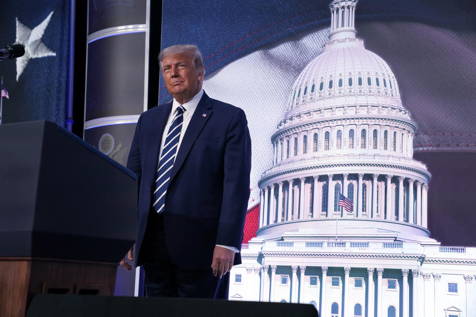 President Donald Trump stands on stage during the 2020 Council for National Policy Meeting, Friday, Aug. 21, 2020, in Arlington, Va. (AP Photo/Evan Vucci)