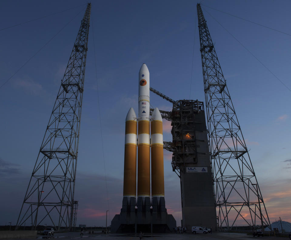 This photo provided by NASA shows the United Launch Alliance Delta IV Heavy rocket with the Parker Solar Probe onboard shortly after the Mobile Service Tower was rolled back, Friday, Aug. 10, 2018, Launch Complex 37 at Cape Canaveral Air Force Station in Cape Canaveral, Fla. NASA is sending a spacecraft straight into the sun's glittering crown, an atmospheric region so hot and harsh any normal visitor would wither. (Bill Ingalls/NASA via AP)