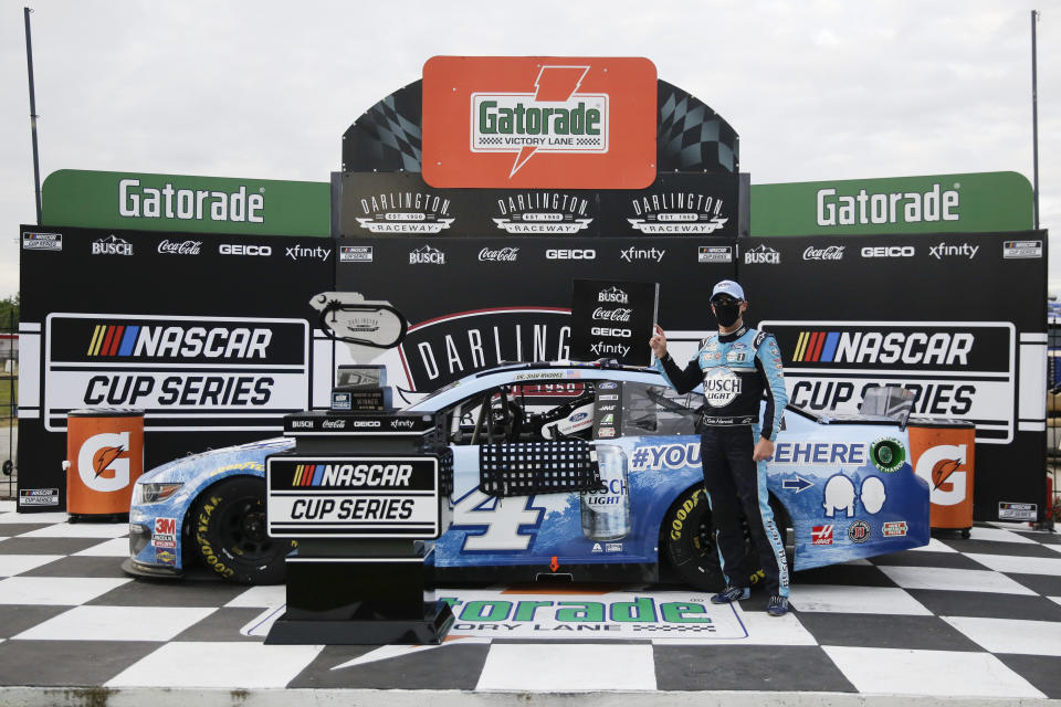 Kevin Harvick celebrates in victory lane after winning the NASCAR Cup Series auto race Sunday, May 17, 2020, in Darlington, S.C. (AP Photo/Brynn Anderson)