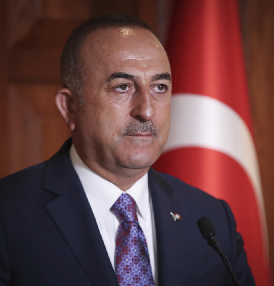 Turkish Foreign Minister Mevlut Cavusoglu speaks to journalists, in Ankara, Turkey, Tuesday, Sept. 10, 2019. Turkey on Tuesday accused the United States of taking "cosmetic steps" toward the creation of a so-called "safe zone" in northeast Syria, renewing a threat for a unilateral military intervention to form a buffer zone along its border. (Turkish Foreign Ministry via AP, Pool)