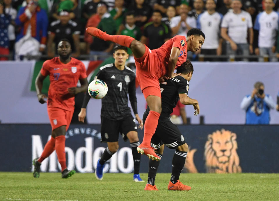 Jul 7, 2019; Chicago, IL, USA; United States midfielder Weston Mckennie (8) battles for the ball with Mexico midfielder Jonathan Dos Santos (6) in the second half championship match of the CONCACAF Gold Cup soccer tournament at Soldier Field. Mandatory Credit: Mike DiNovo-USA TODAY Sports