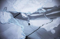 <p>Ice is viewed near the coast of West Antarctica from a window of a NASA Operation IceBridge airplane on Oct. 27, 2016 in flight over Antarctica. (Photo: Mario Tama/Getty Images) </p>