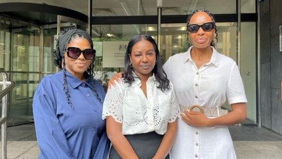 Danae Thomas, Selma Taha, and Divina Riggon outside the court