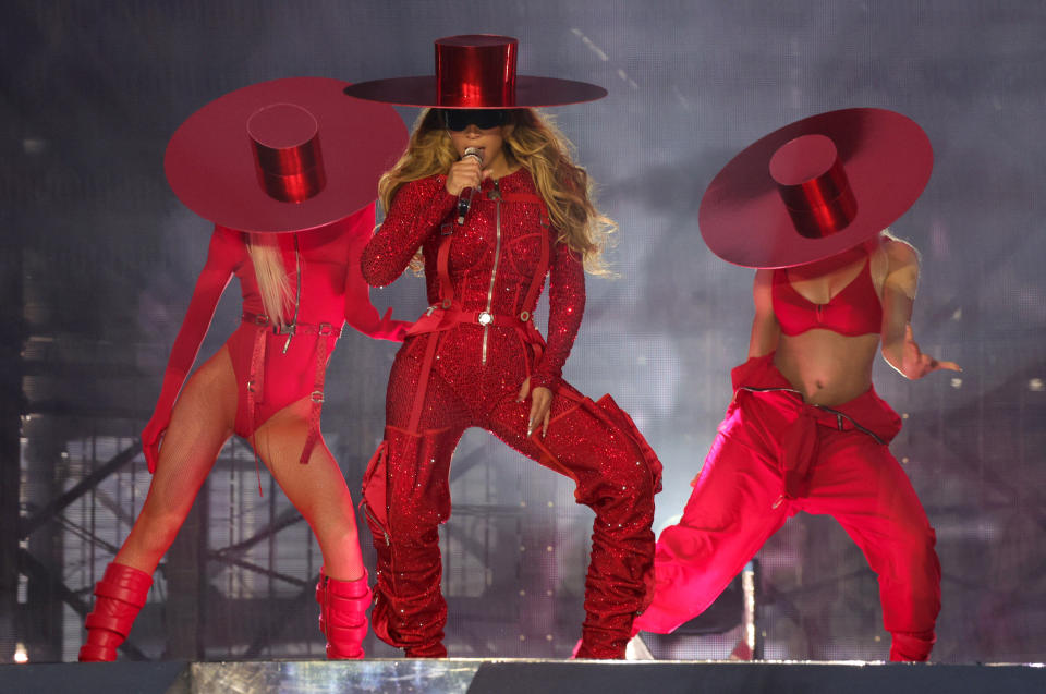 Beyoncé performing onstage with backup dancers.