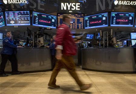 Traders work on the floor of the New York Stock Exchange February 19, 2014. REUTERS/Brendan McDermid