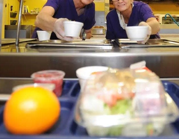 Don Shifflett and Audrey Comm serve more than 450 school lunches at the Rehoboth Beach Elementary School in Rehoboth Beach in 2014.