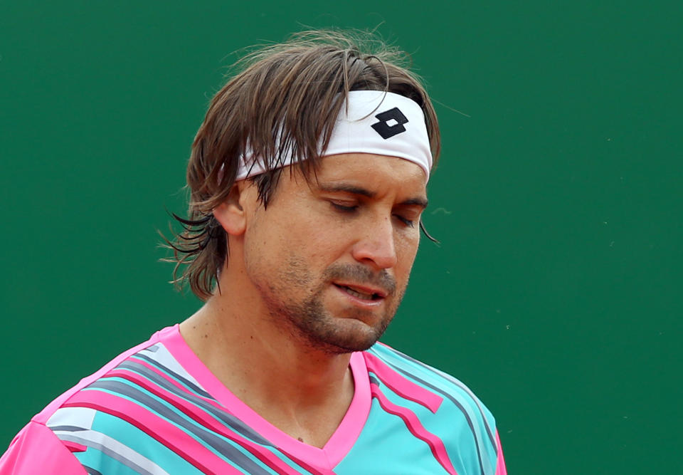 David Ferrer of Spain loses a point to Stanislas Wawrinka of Switzerland during their semifinal match of the Monte Carlo Tennis Masters tournament in Monaco, Saturday April 19, 2014. Wawrinka won 6-1, 7-6. (AP Photo/Claude Paris)