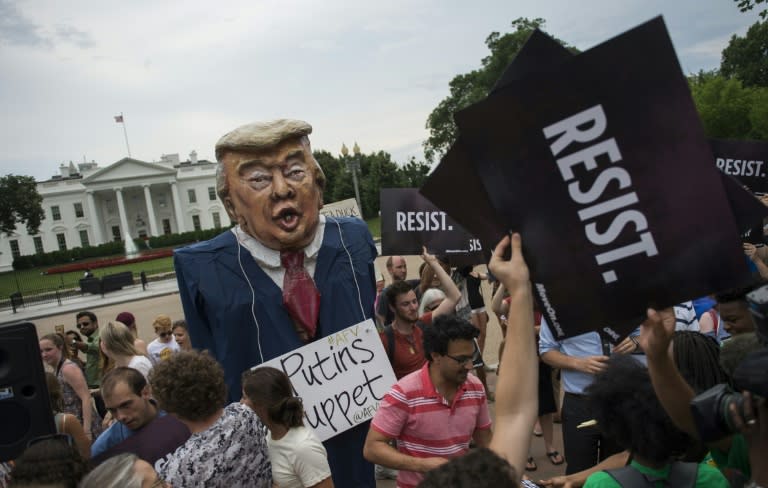 Protesters call for accountability over the Trump campaign's alleged collusion with the Russian Government in front of the White House on July 11, 2017