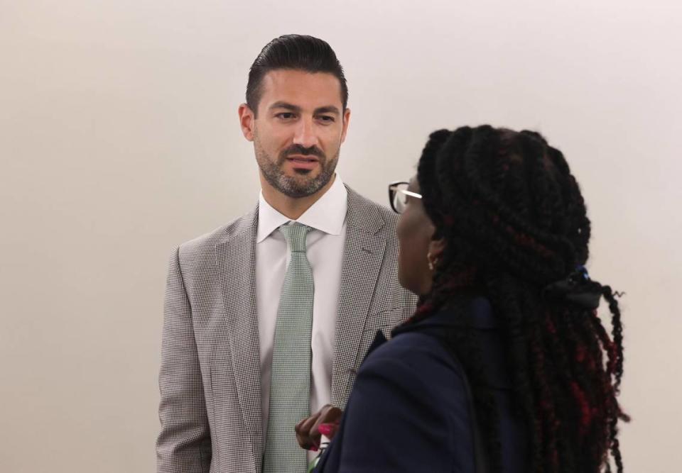 Gino Santorio talks with an attendee after a press conference unveiling Keiser University’s nursing advisory council on Wednesday, July 13, 2022, in the Hyatt Regency at the National Association of Hispanic Nurses Conference in Miami. The panel discussed how to retain nurses in Florida amid a national shortage.