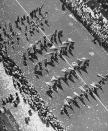 <p>Independence Day parade participants march up Fifth Avenue, New York City, 1942. (Photo: Andreas Feininger/The LIFE Picture Collection/Getty Images) </p>