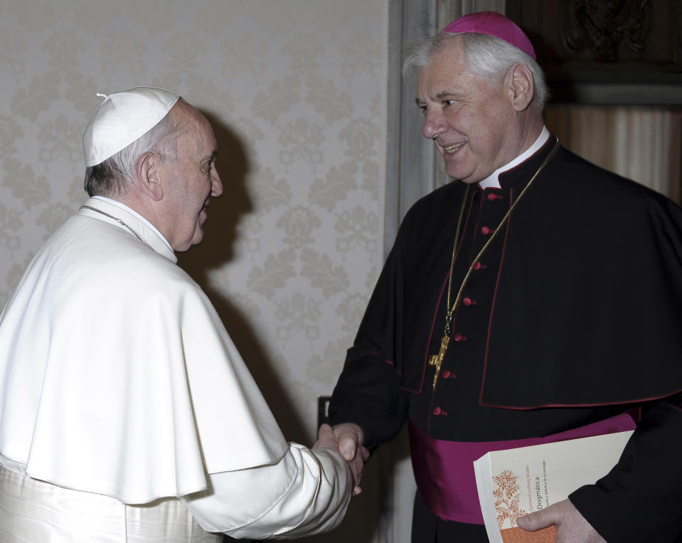 CAPTION CORRETS YEAR OF ANNOUNCEMENT. FILE - In this April 5, 2013 file photo made available by the Vatican newspaper L'Osservatore Romano, Pope Francis, left, meets with Bishop Gerhard Ludwig Mueller, Prefect of the Congregation for the Doctrine of the Faith, at the Vatican. Mueller is amongst the 19 new cardinals that Pope Francis announced Sunday, Jan. 12, 2014 during his Angelus prayer from his studio window overlooking St. Peter's Square. The ceremony to formally install them as cardinals will be held Feb. 22 at the Vatican. (AP Photo/L'Osservatore Romano, ho)