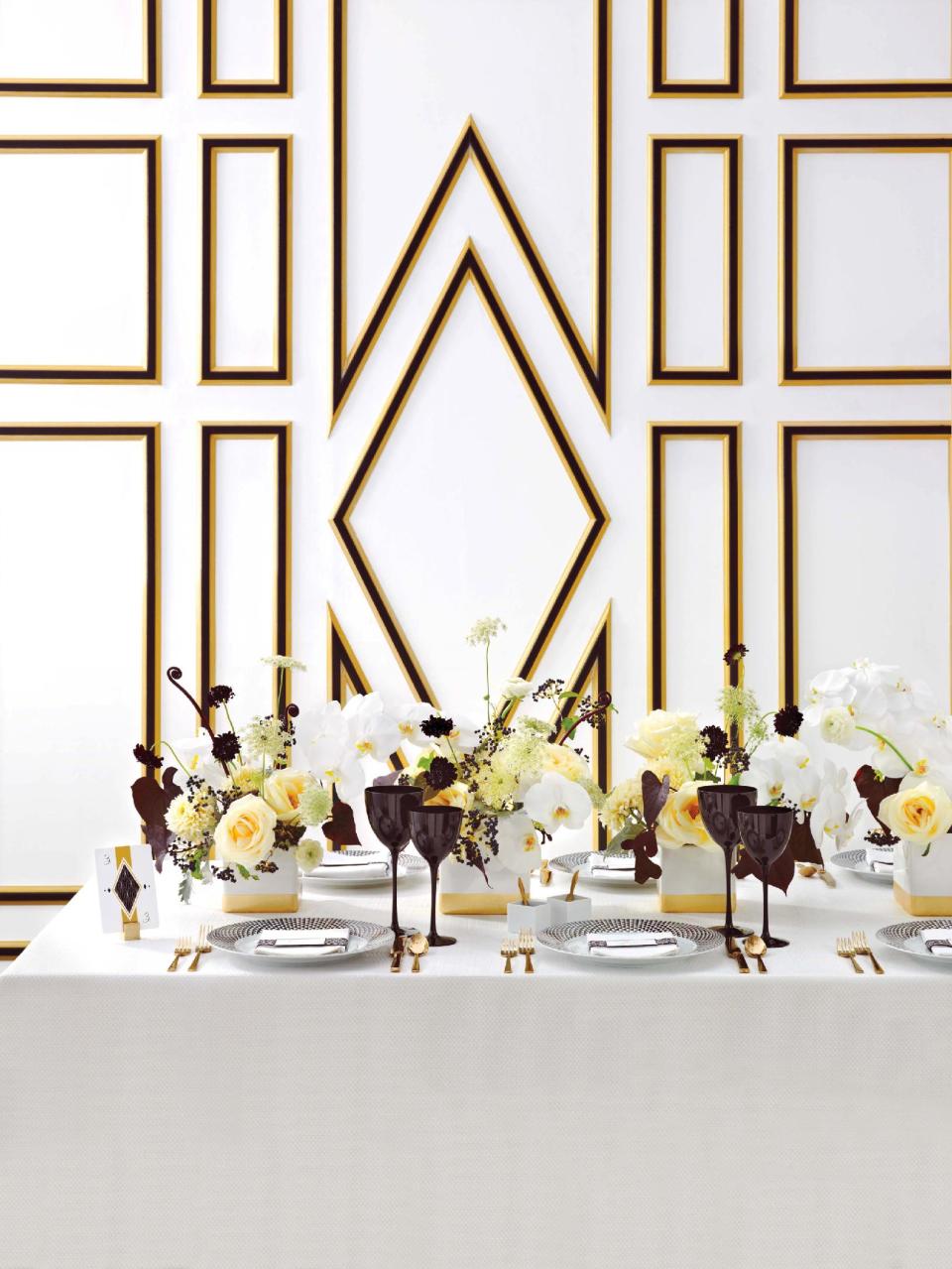 This 2011 photo provided by courtesy of Martha Stewart Weddings shows Art Deco motifs and colors – black, white and gold – that bring an elegant, vintage glamour to the reception of a jazz age style wedding. (AP Photo/Martha Stewart Weddings, Lucas Allen)