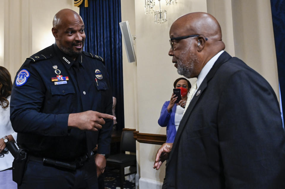 U.S. Capitol Police Sgt. Harry Dunn speaks with Chairman Rep. Bennie Thompson, D-Miss., after a House select committee hearing on the Jan. 6 attack on Capitol Hill in Washington, Tuesday, July 27, 2021. (Andrew Caballero-Reynolds/Pool via AP)