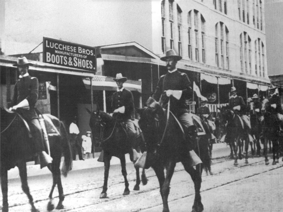 First Reg. Texas Volunteer Cavalry in front of Lucchese store in San Antonio, Texas.