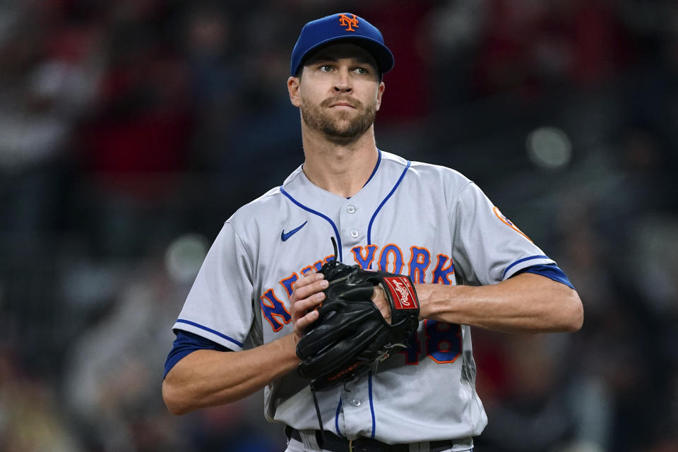New York Mets starting pitcher Jacob deGrom reacts after giving up a home run to Atlanta Braves' Austin Riley during the second inning of a baseball game Friday, Sept. 30, 2022, in Atlanta. (AP Photo/John Bazemore)