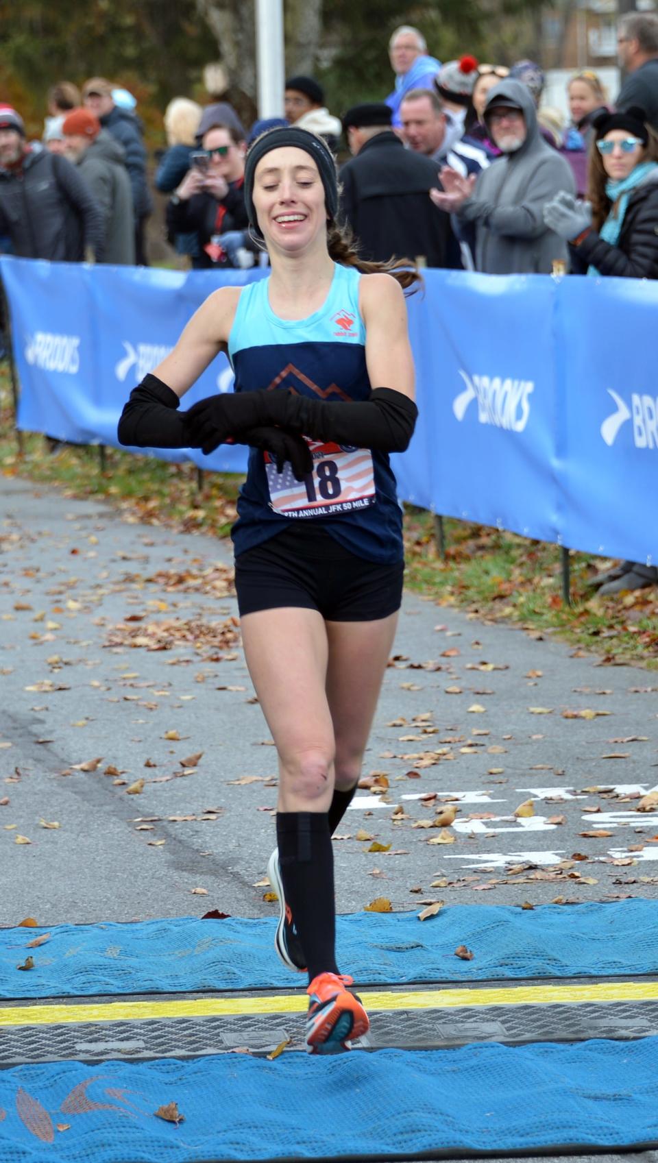 Sarah Biehl smiles as she crosses the finish line to take second in the women's race in 6:22:03 at the 59th annual JFK 50 Mile ultramarathon on Saturday. Biehl's time ranks fourth among women in JFK history.