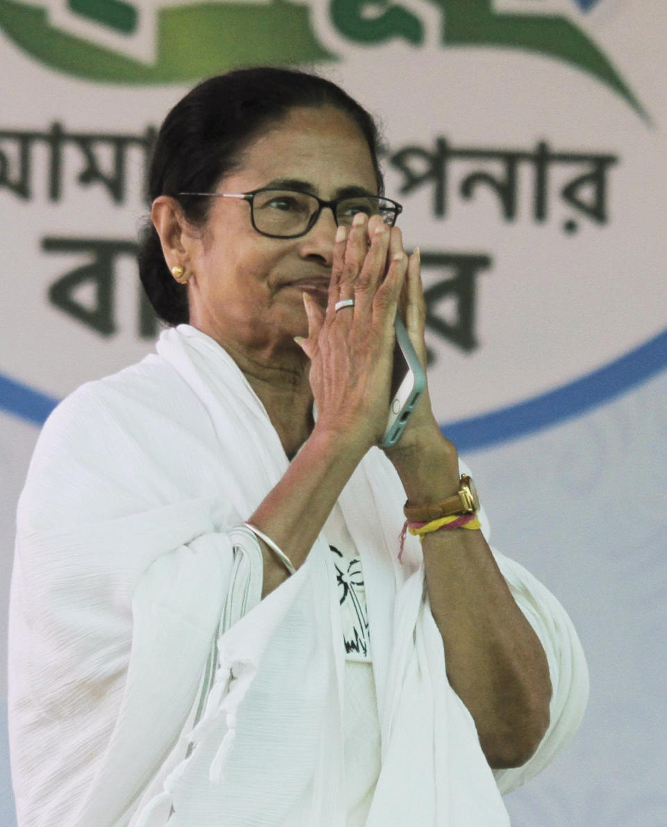 Trinamool Congress leader and Chief Minister of West Bengal state Mamata Banerjee greets the audience at an election rally at Anchana in Mathurapur, about 60 kilometers south of Kolkata, India, Thursday, May 16, 2019. With 900 million of India's 1.3 billion people registered to vote, the Indian national election is the world's largest democratic exercise. The seventh and last phase of the elections will be held on Sunday. (AP Photo/Bikas Das)