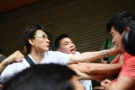 In some neighbourhoods like North Point, scuffles have broken out between pro-Beijing supporters (L) and protesters or media