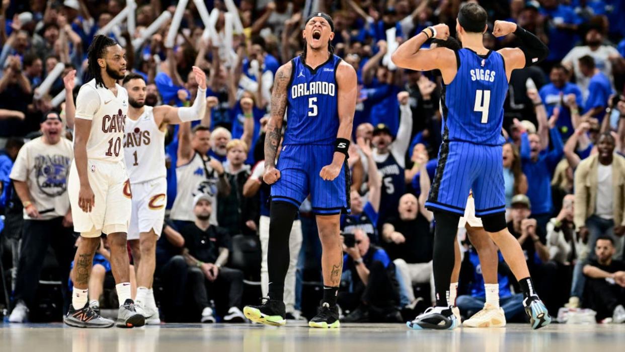 <div>ORLANDO, FLORIDA - MAY 03: Paolo Banchero #5 of the Orlando Magic celebrates with Jalen Suggs #4 after a basket against the Cleveland Cavaliers during the fourth quarter in Game Six of the Eastern Conference First Round Playoffs at Kia Center on May 03, 2024 in Orlando, Florida. (Photo by Julio Aguilar/Getty Images)</div>