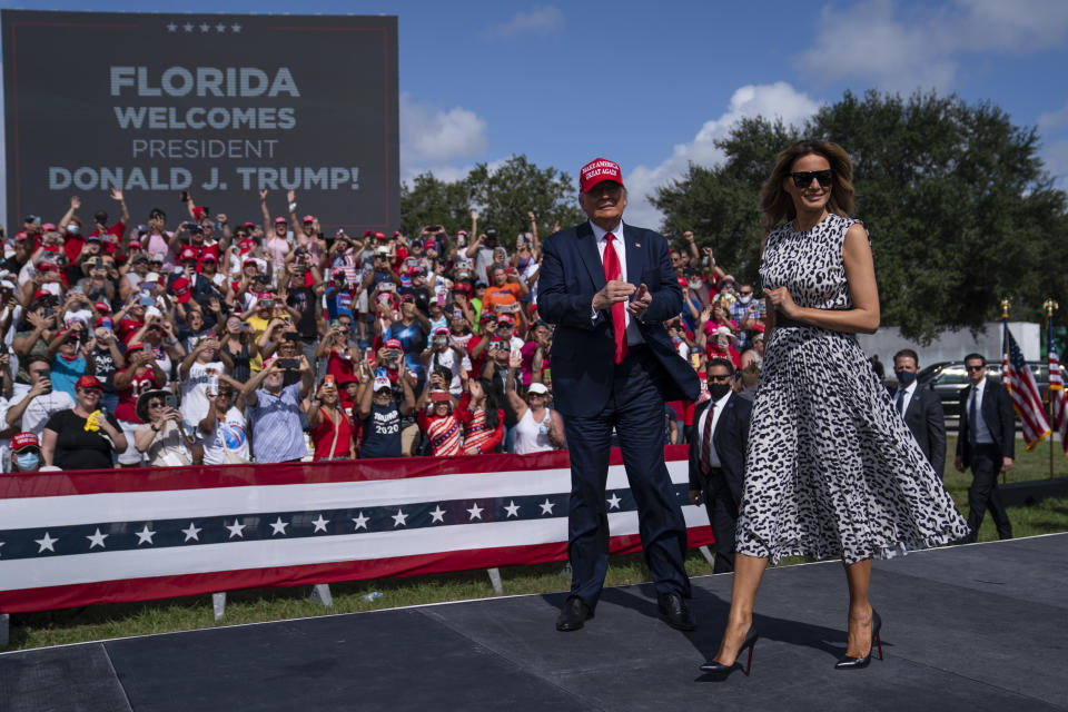 President Donald Trump and first lady Melania Trump arrive for a campaign rally outside Raymond James Stadium, Thursday, Oct. 29, 2020, in Tampa. (AP Photo/Evan Vucci)