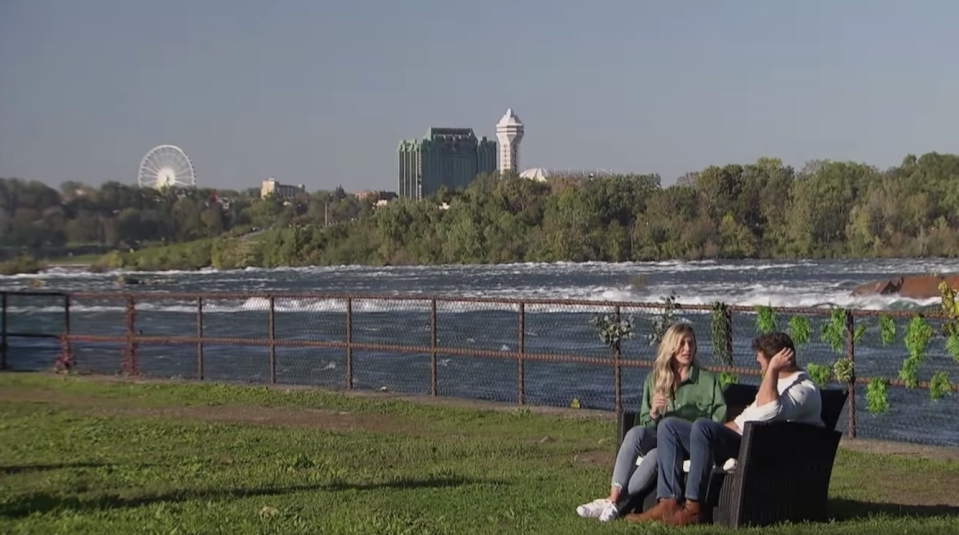 two people on a date outside with the city views behind them