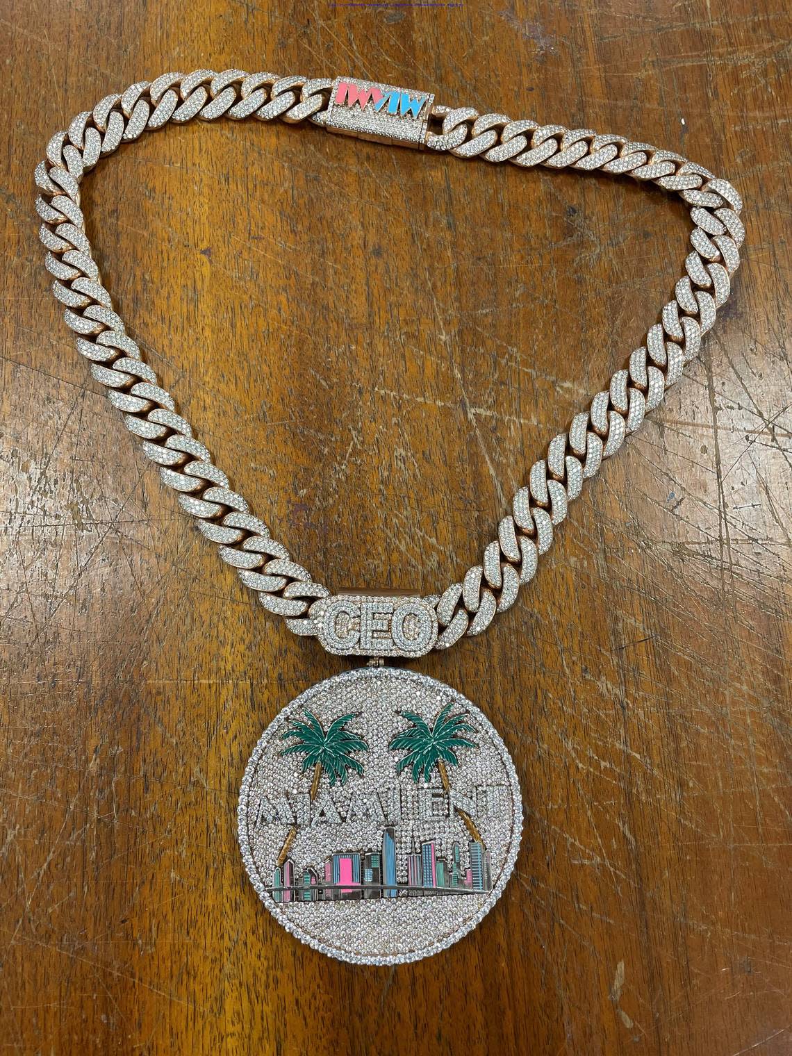 Andre Lorquet spent $129,600 in government-backed pandemic loans on this custom-made diamond necklace with a pendant of the city of Miami skyline.