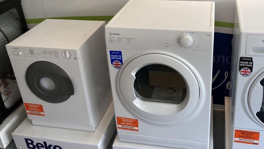 A load of white tumble dryers 