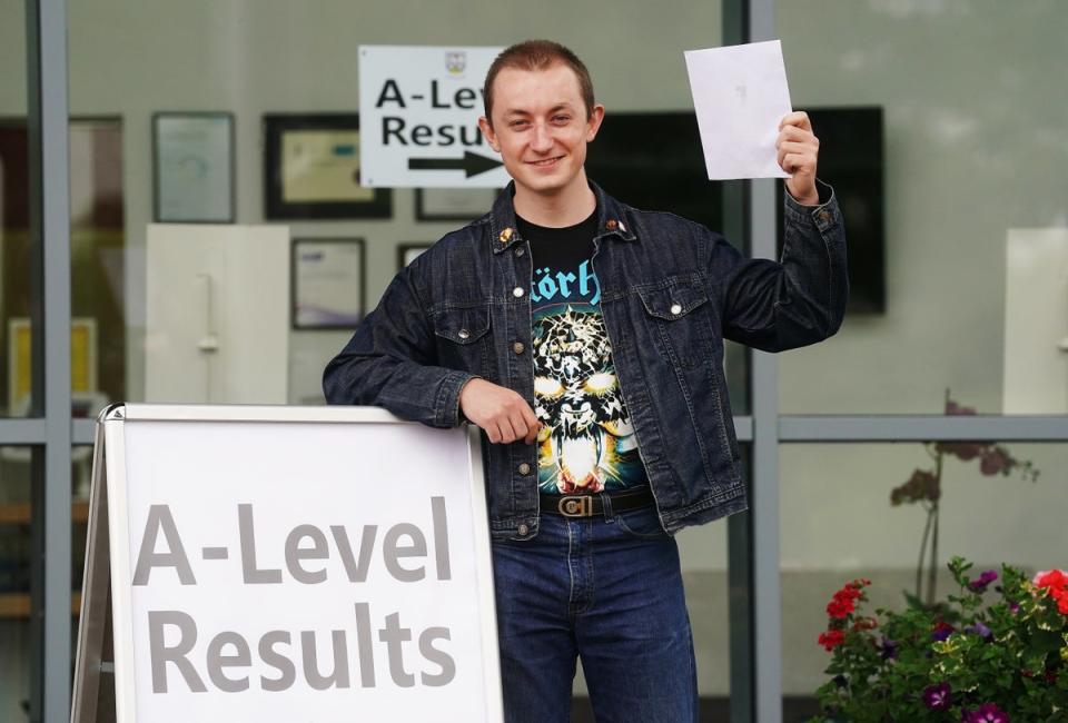 Drew Totton celebrates after receiving his A-level results at Lagan College, Belfast (PA) (PA Wire)