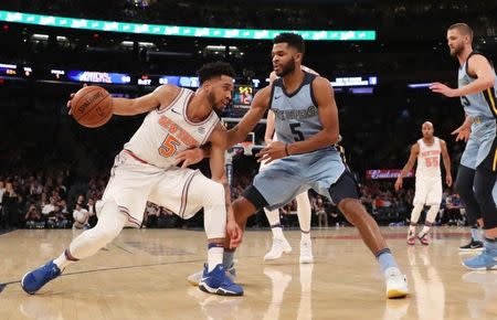 Dec 6, 2017; New York, NY, USA; New York Knicks guard Courtney Lee (5) drives around Memphis Grizzlies guard Andrew Harrison (5) during the third quarter at Madison Square Garden. Mandatory Credit: Anthony Gruppuso-USA TODAY Sports