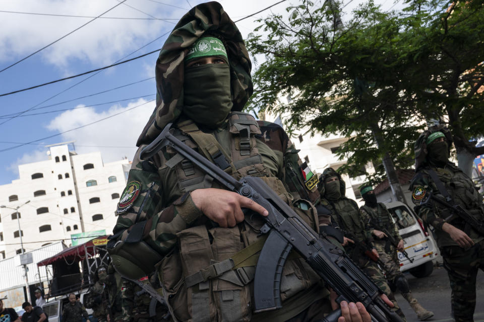 Hamas militants parade through the streets for Bassem Issa, a top Hamas' commander, who was killed by Israeli Defense Force military actions prior to a cease-fire reached after an 11-day war between Gaza's Hamas rulers and Israel, in Gaza City, Saturday, May 22, 2021. (AP Photo/John Minchillo)