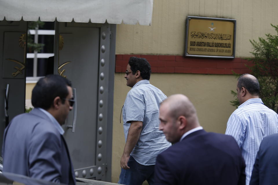 Staff arrive at the Saudi Arabia consulate in Istanbul, Tuesday, Oct. 9, 2018. Turkey said Tuesday it will search the Saudi Consulate in Istanbul as part of an investigation into the disappearance of Jamal Khashoggi, a missing Saudi contributor to The Washington Post, a week after he vanished during a visit there. (AP Photo/Lefteris Pitarakis)