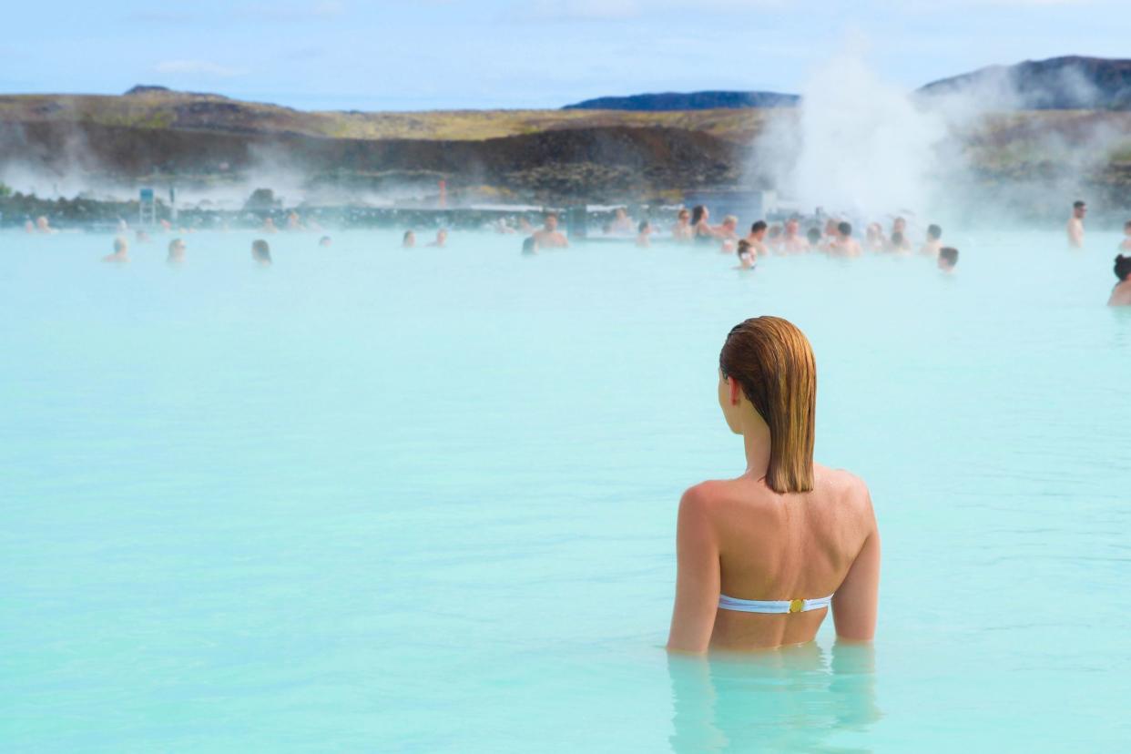 woman in hot spring in iceland