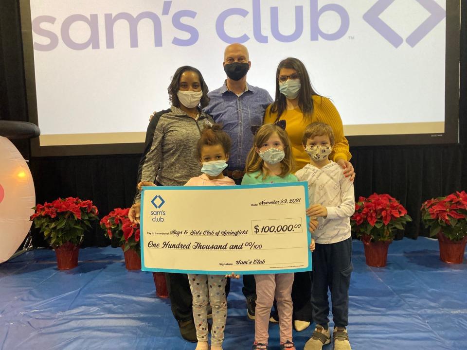 Brandy Harris, chief executive officer of of Boys & Girls Clubs of Springfield (far right) accepts the $100,000 donation.