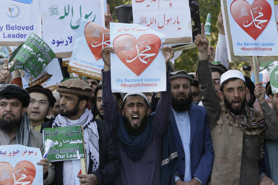 Afghans shout slogans during a protest against French President Macron's comments over Prophet Muhammad caricatures, in Kabul, Afghanistan, Friday, Oct. 30, 2020. (AP Photo/Mariam Zuhaib)