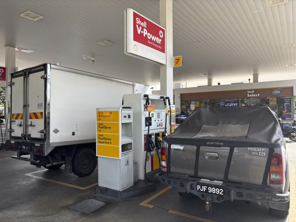 A diesel car owner pumps at a petrol station in Kuala Lumpur, Malaysia, Monday, June 10, 2024. Diesel price in Malaysia jumped by more than 50% on Monday as part of a revamp of decades-old fuel subsidies to tighten government spending and save billions of ringgits annually. (AP Photo/Vincent Thian)