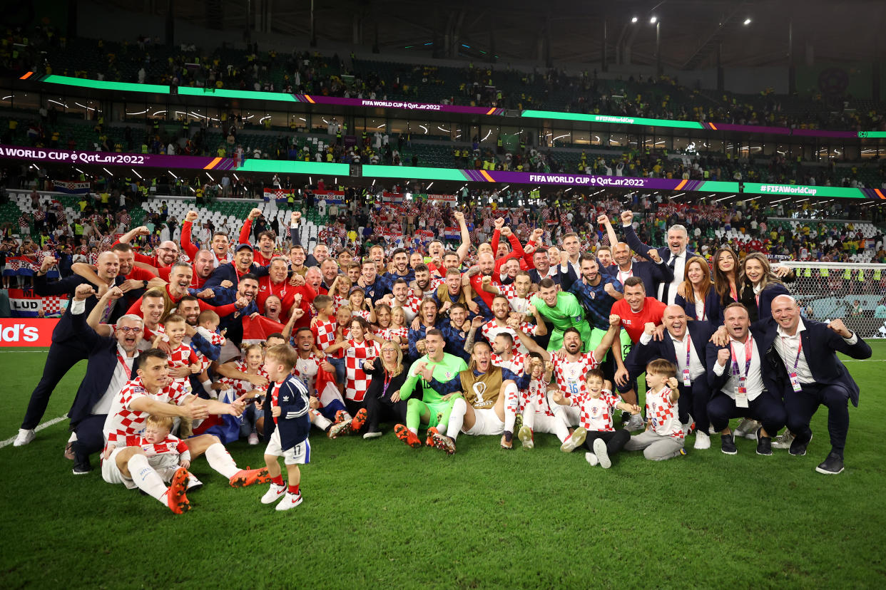 AL RAYYAN, QATAR - DECEMBER 09: Croatia players celebrate their win via a penalty shootout during the FIFA World Cup Qatar 2022 quarter final match between Croatia and Brazil at Education City Stadium on December 09, 2022 in Al Rayyan, Qatar. (Photo by Hector Vivas - FIFA/FIFA via Getty Images)