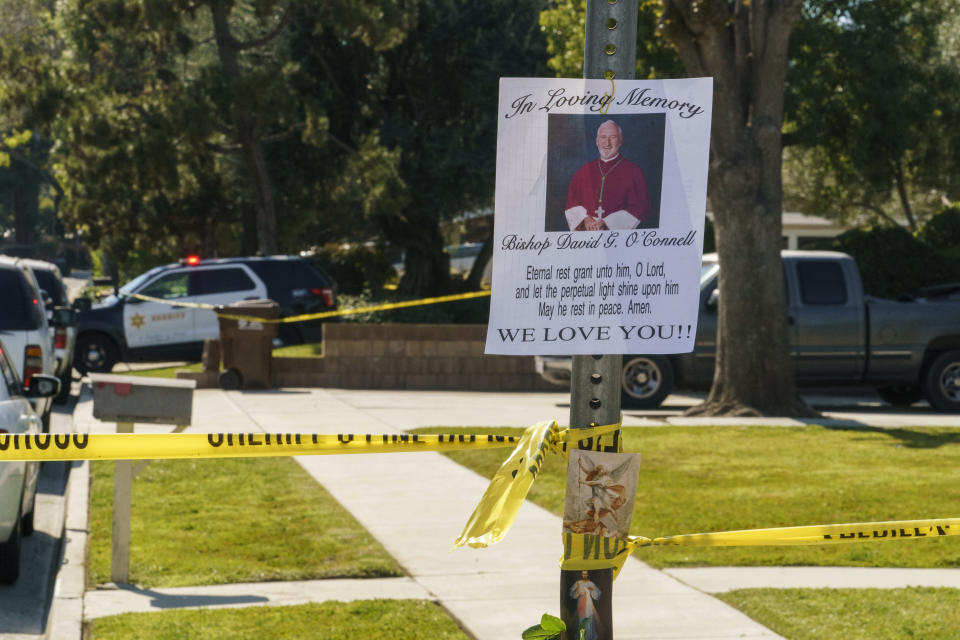 An image of Bishop David O'Connell is posted on the post of a street sign near his home in Hacienda Heights, Calif., Sunday, Feb. 19, 2023. O'Connell was shot and killed Saturday just blocks from a church, a slaying of a longtime priest hailed as a "peacemaker" that's stunned the Los Angeles religious community, authorities said. Detectives are investigating the death as a homicide, according to the Los Angeles County Sheriff's Department. (AP Photo/Damian Dovarganes)