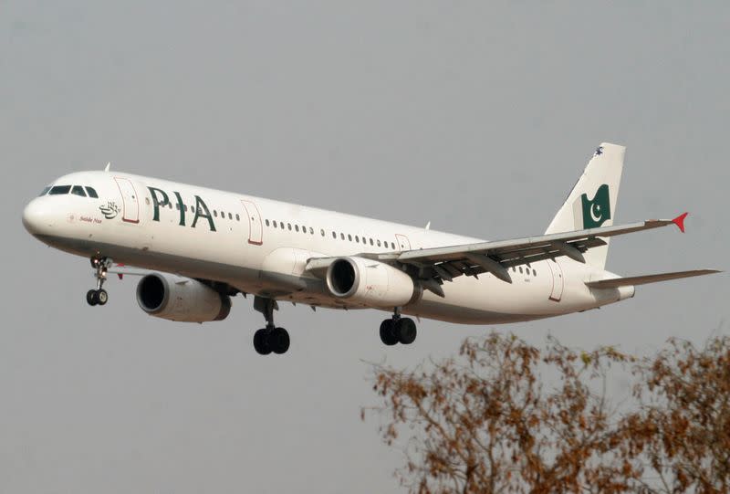 FILE PHOTO: A Pakistan International Airlines plane prepares to land at Islamabad airport in Islamabad