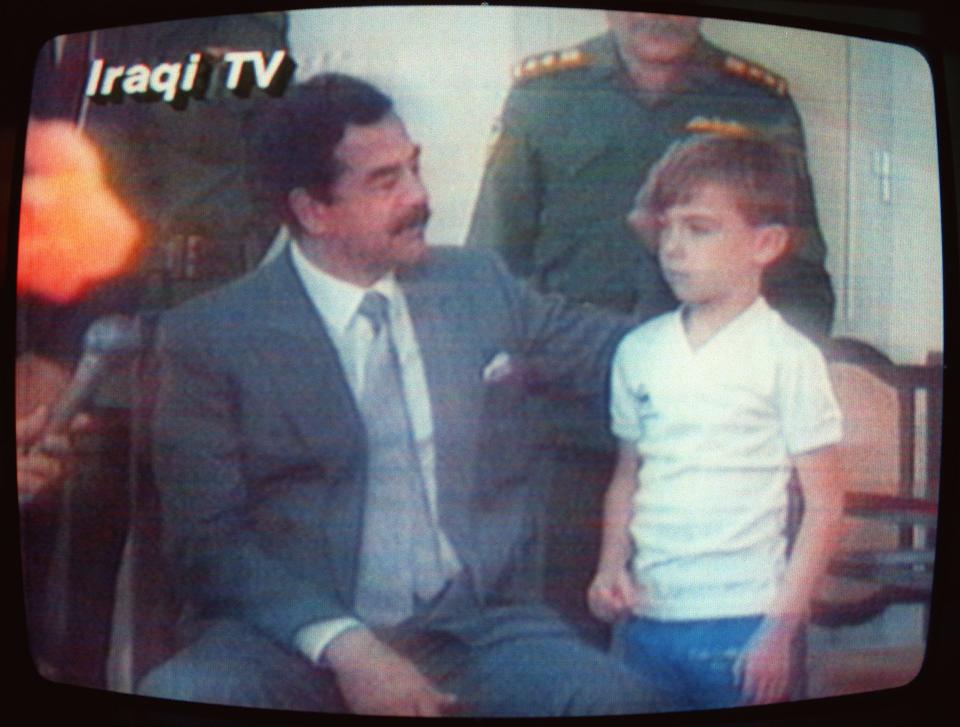 Iraqi dictator Saddam Hussein parades British six-year-old Stuart Lockwood on TV