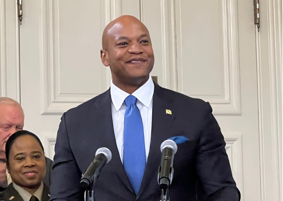 Gov. Wes Moore, a Democrat, stands at the lectern before signing an executive order on artificial intelligence in the State House in Annapolis on Jan. 8, 2024. As of Tuesday afternoon, he has not yet publicly announced the details of his housing package.