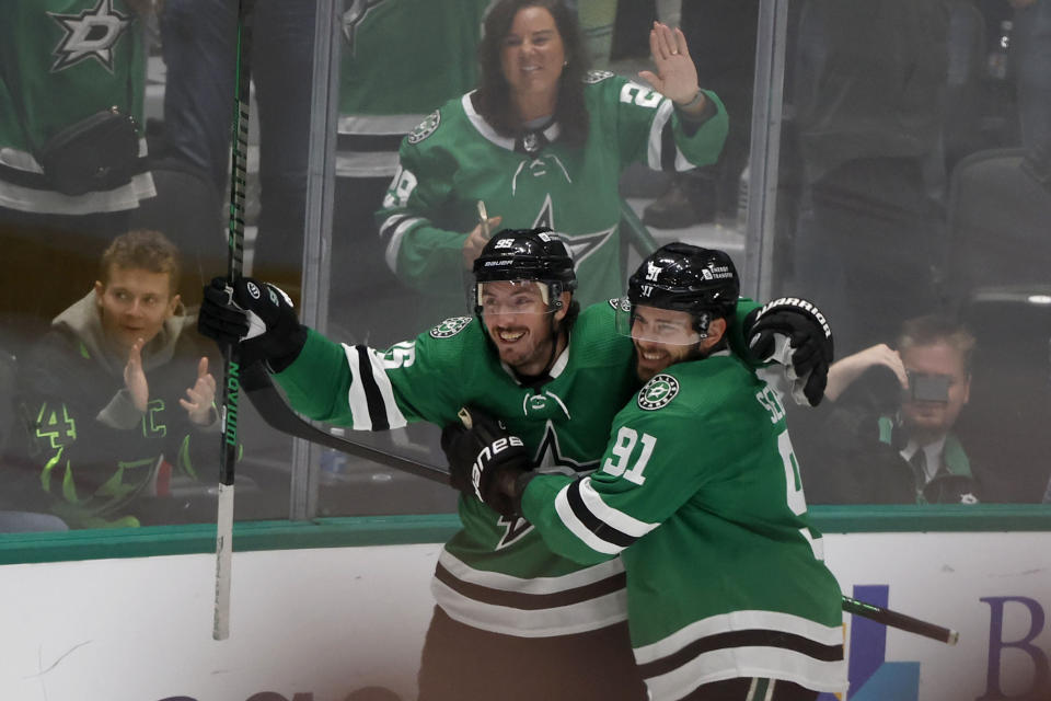 Dallas Stars center Matt Duchene (95) celebrates after a goal against the Ottawa Senators with center Tyler Seguin (91) during the third period of an NHL hockey game in Dallas, Friday, Dec. 15, 2023. (AP Photo/Michael Ainsworth)