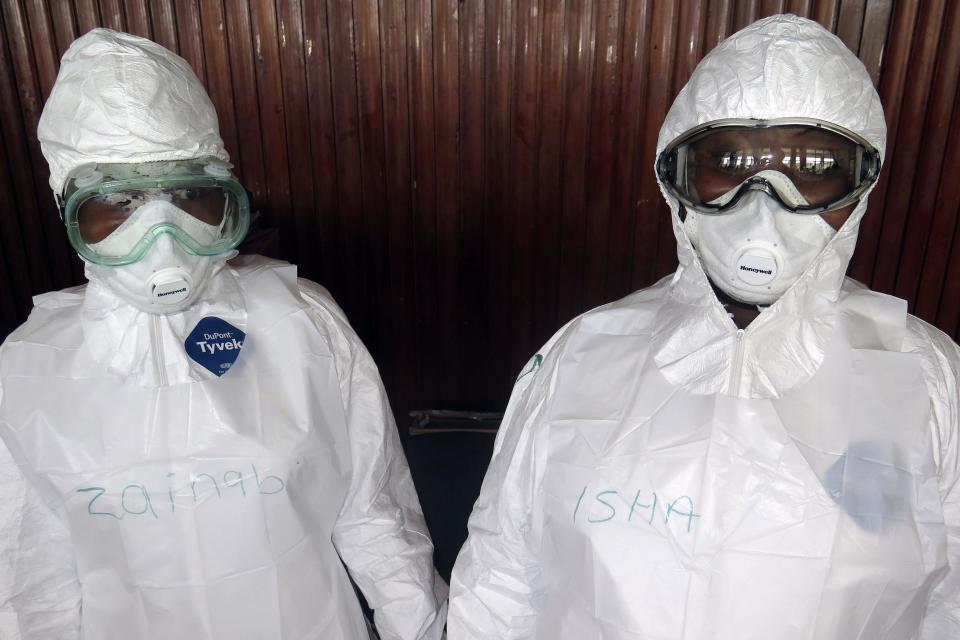 REFILE - CORRECTING COUNTRY IDENTIFIER AFTER BYLINE The names of trainee health workers are seen written on their protective suits at a World Health Organization (WHO) training session in Freetown September 30, 2014. The death toll from the world's worst Ebola outbreak on record reached 3,338 people out of 7,178 cases in West Africa as of Sept. 28, the World Health Organization said on Wednesday. Picture taken September 30. REUTERS/Umaru Fofana (SIERRA LEONE - Tags: HEALTH DISASTER)